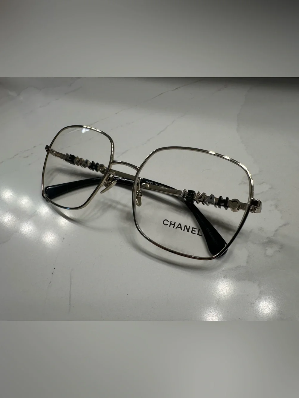 CHANEL Gold Frame Glasses with Black Temple Tips